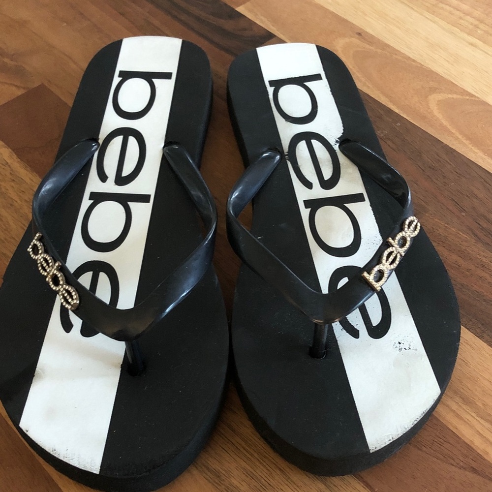 bebe Black and White Logo Flip Flop Sandals with Gold Accent